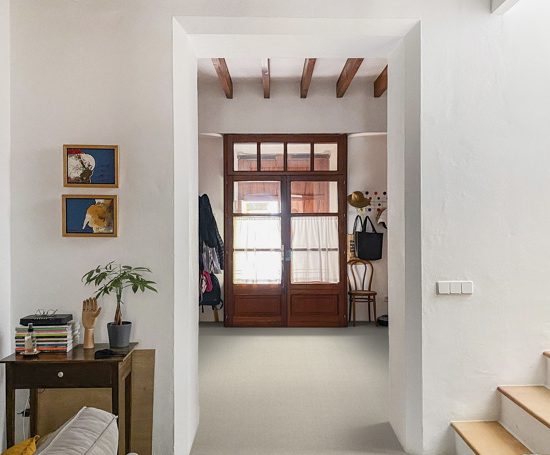 Home decoration of the hall of a restored Majorcan house with wooden beams